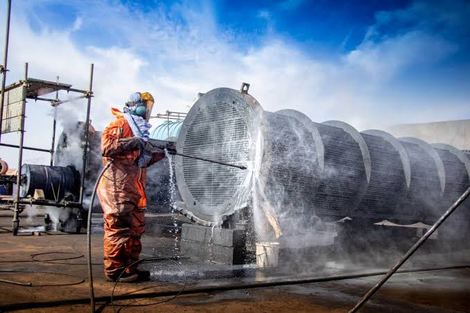 Cleaning oil and grime from plant machinery